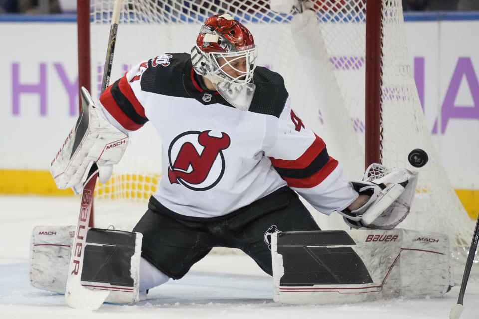 New Jersey Devils goaltender Vitek Vanecek (41) makes a save in the first period of an NHL hockey game against the New York Rangers, Monday, Nov. 28, 2022, in New York. (AP Photo/John Minchillo)