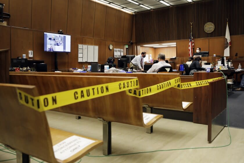 LOS ANGELES, CA - APRIL 21, 2020: Los Angeles Superior Court Judge Miguel Espinoza holds video arraignments in his courtroom at Clara Shortridge Foltz Criminal Justice Center on Tuesday, April 21, 2020 in Los Angeles, CA. (Myung J. Chun / Los Angeles Times)