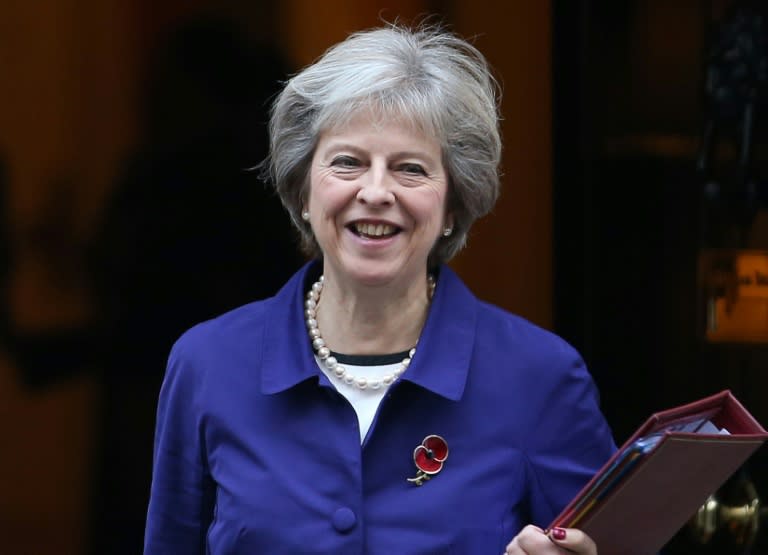 British Prime Minister Theresa May brands as "outrageous" FIFA's opposition to the wearing of poppies on their shirts