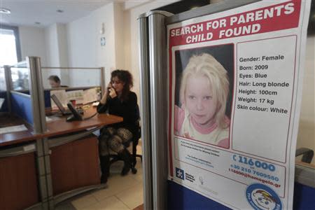 A poster of a four-year-old girl known as Maria, who was found living with a couple in a Roma camp in central Greece, is pictured in the office of the "Smile of the Child" charity, which is taking care of the child as police search for her biological parents, in an Athens suburb October 19, 2013. REUTERS/John Kolesidis