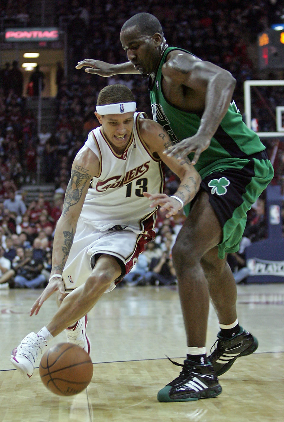 Delonte West dribbles past defense on the basketball court.