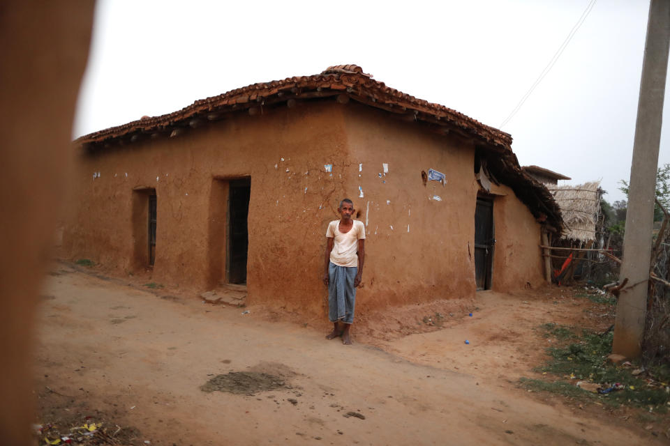 Vijayee Pratap Gupta, 60, a grocery shopkeeper and one of the few in the area to get vaccinated against COVID-19 stands outside his home in Jamsoti village, Uttar Pradesh state, India, on June 8, 2021. India's vaccination efforts are being undermined by widespread hesitancy and fear of the jabs, fueled by misinformation and mistrust. That's especially true in rural India, where two-thirds of the country’s nearly 1.4 billion people live. (AP Photo/Rajesh Kumar Singh)