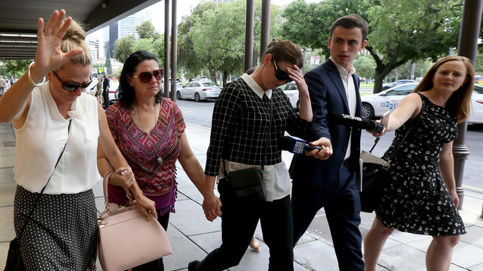 The family of Sonia Mackay leave the District court in Adelaide on December 12 after she was sentenced to a maximum of four years in jail. Source: AAP