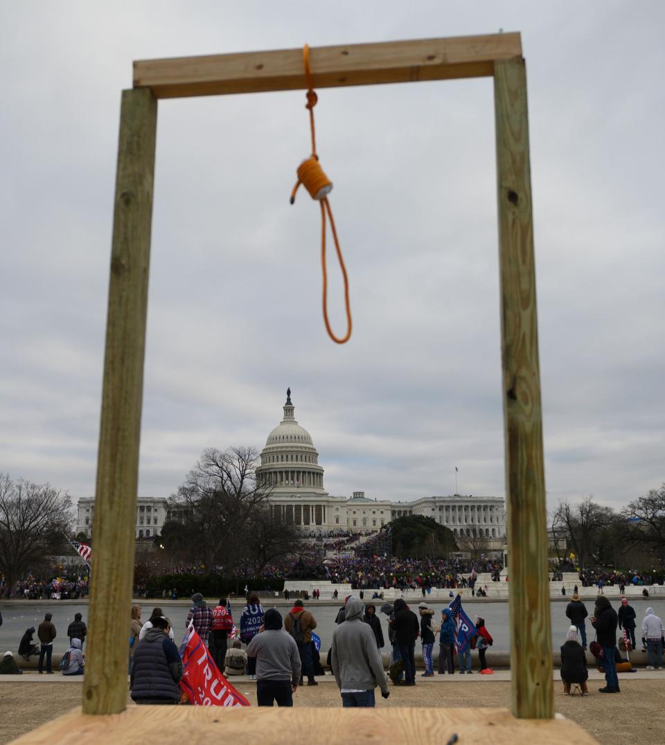 A noose on makeshift gallows outside the U.S. Capitol on Wednesday, when supporters of President Donald Trump forced their way into the building. Much of the imagery that has emerged in subsequent days has captured just how violent the siege was.  (Photo: ANDREW CABALLERO-REYNOLDS via Getty Images)