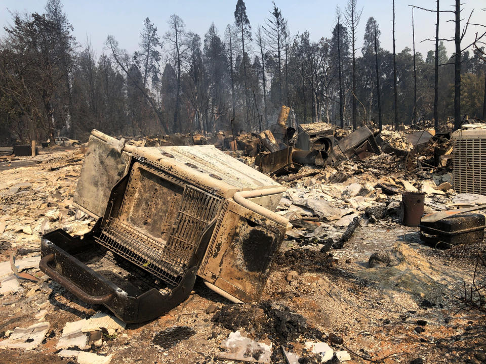 The ruins of homes destroyed by a wildfire litters the ground in Phoenix, Ore., Thursday, Sept. 10, 2020. (AP Photo/Gillian Flaccus)