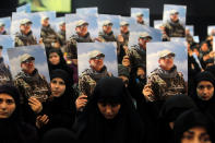 <p>Women carry pictures of Hezbollah commander Mustafa Badreddine, who was killed in an attack in Syria, during a ceremony marking a year after his death in Beirut’s southern suburbs, Lebanon May 11, 2017. (Photo: Aziz Taher/Reuters) </p>