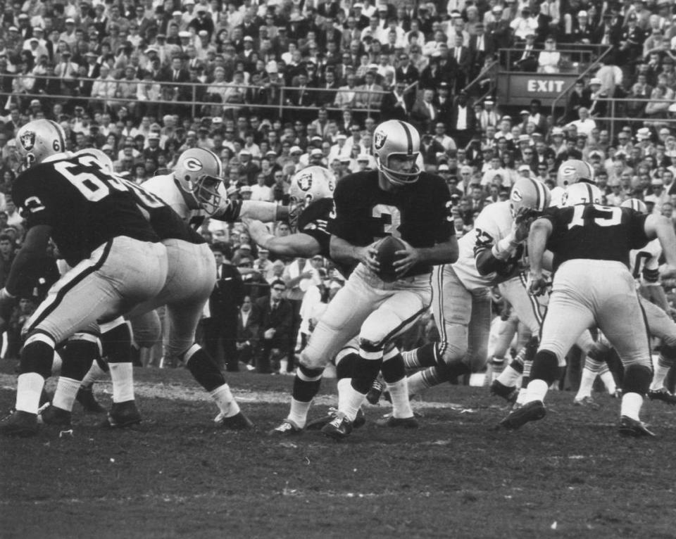 SUPER BOWL II, Jan. 14, 1968 - Green Bay 33, Oakland Raiders 13: ***** Raiders quarterback Daryle Lamonica (3), behind offensive linemen Gene Upshaw (63) and Jim Otto (00), looks to hand off during a losing effort.