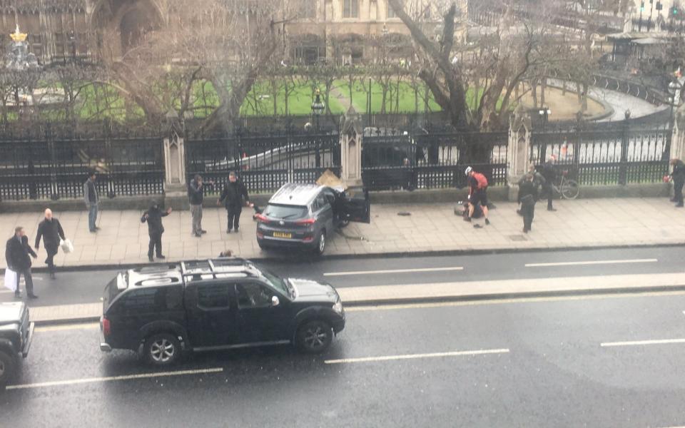 The attacker's Hyundai 4x4 is seen just yards from the House of Commons after crashing into railings.