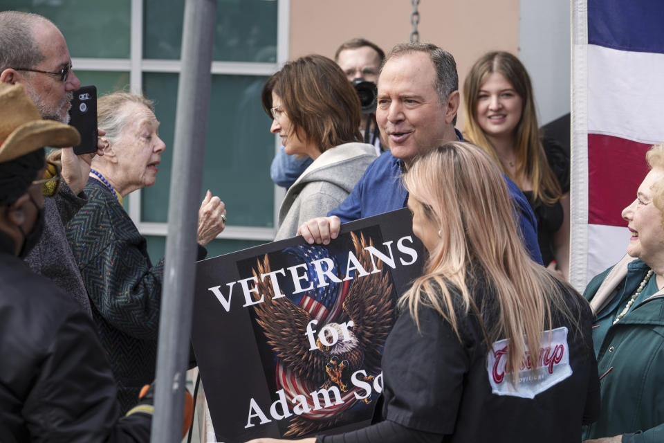 California Congressman Adam Schiff, D-Burbank, talks to a U.S. veteran with his wife Eve Schiff, left, and their daughter Alexa 'Lexi' Schiff, top right, after addressing members of the International Alliance of Theatrical Stage Employees, IATSE at their Union Hall in Burbank, Calif., Saturday, Feb. 11, 2023. Two weeks ago, Schiff launched his campaign for the U.S. Senate, raising $1.6 million in chiefly small-dollar donations. Schiff was quickly endorsed by Speaker Emerita Nancy Pelosi and 40 percent of the California Democratic congressional delegation. (AP Photo/Damian Dovarganes)