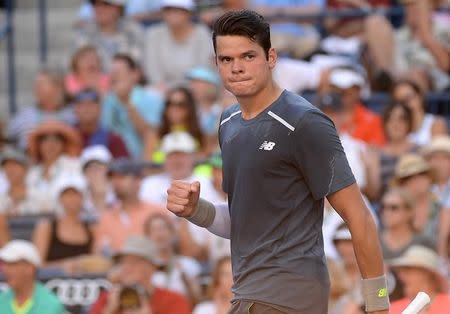 Mar 20, 2015; Indian Wells, CA, USA; Milos Raonic (CAN) pumps his fist as he looks to his coach after defeating Rafael Nadal (ESP) 4-6, 7-6, 7-5 in quarter finals in the BNP Paribas Oopen at the Indian Wells Tennis Garden. Mandatory Credit: Jayne Kamin-Oncea-USA TODAY