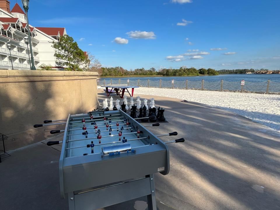 foosball table and big chess set near the beach area at the grand floridian resort