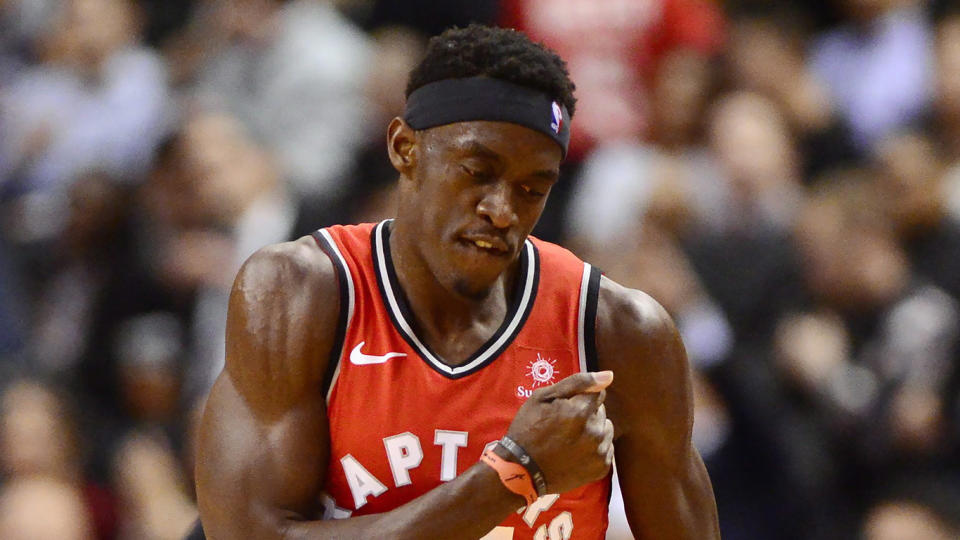 FILE - In this Feb. 13, 2019, file photo, Toronto Raptors forward Pascal Siakam celebrates scoring a 3-pointer against the Washington Wizards during the second half of an NBA basketball game, in Toronto.  Siakam may be the favorite for the NBA's Most Improved Player award. But to him, that's not as important as the respect he's earned from his peers and the chance he has to help the Toronto Raptors win a title. (Frank Gunn/The Canadian Press via AP, File)