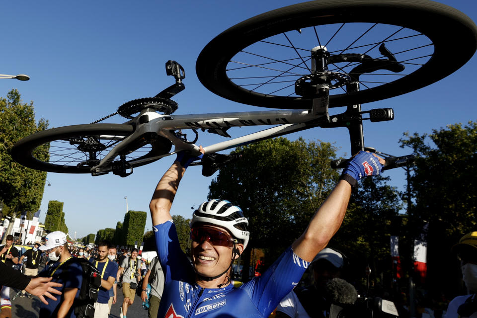 Belgium's Jasper Philipsen celebrates after winning the twenty-first stage of the Tour de France cycling race over 116 kilometers (72 miles) with start in Paris la Defense Arena and finish on the Champs Elysees in Paris, France, Sunday, July 24, 2022. (Gonzalo Fuentes/Pool Photo via AP)