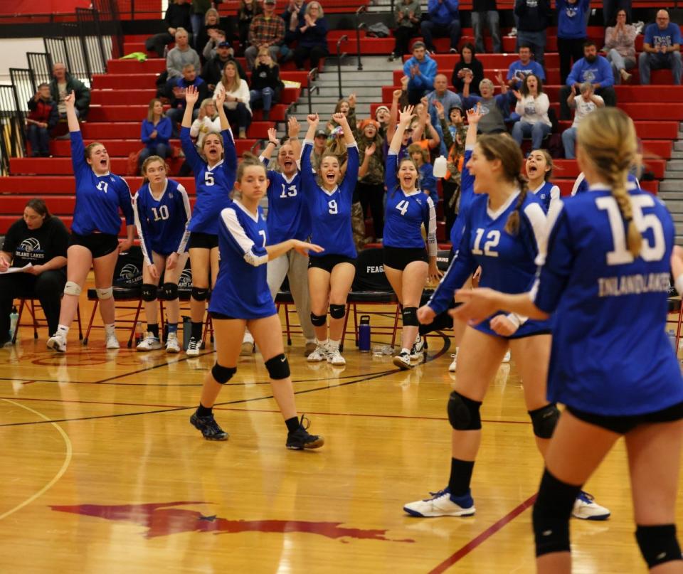 Inland Lakes players celebrate a point both on the court and from the bench during Thursday's quarterfinal contest against Crystal Falls Forest Park at Marquette.