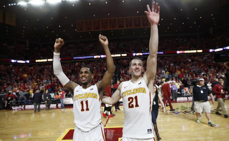 Monte Morris (left) went out a winner at Hilton Coliseum. (AP)