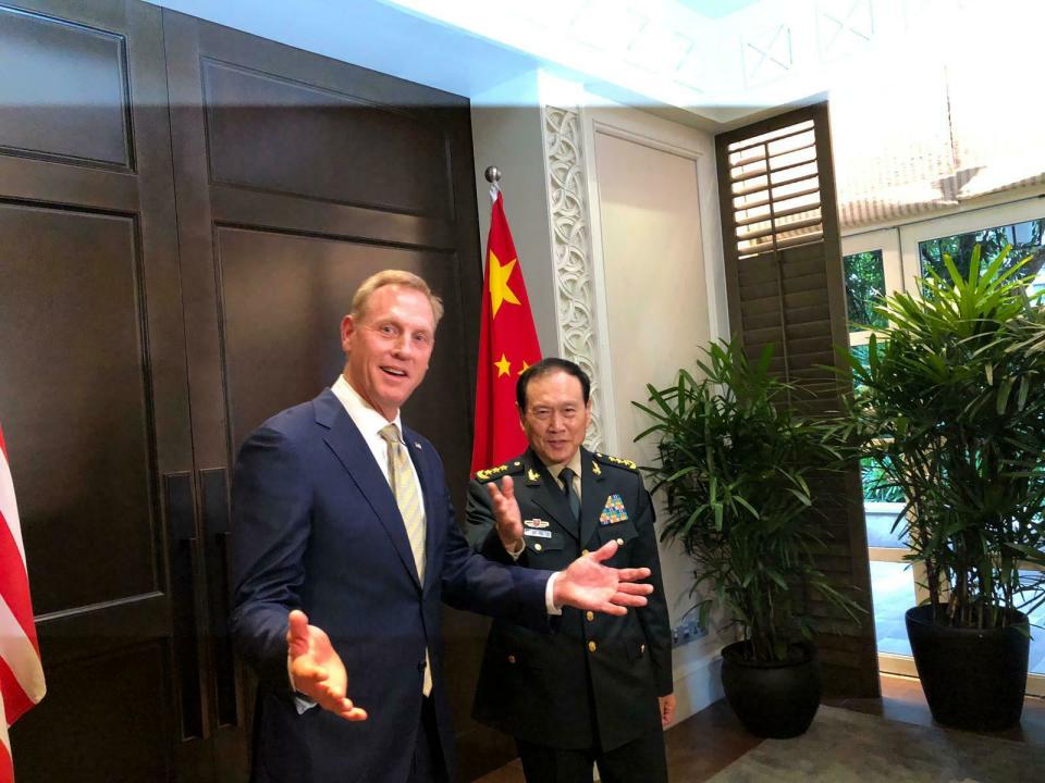 Acting U.S. Secretary of Defense Patrick Shanahan, left, meets with China's Minister of National Defense Wei Fenghe during a meeting on the sidelines of the 18th International Institute for Strategic Studies (IISS) Shangri-la Dialogue, an annual defense and security forum in Asia, in Singapore, Friday, May 31, 2019. (AP Photo/Lolita Baldor)