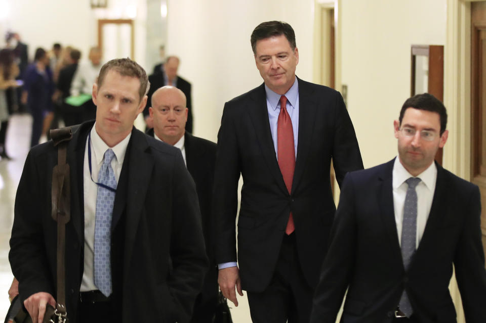 Former FBI Director James Comey, second from right, leaves Capitol Hill in Washington, Monday, Dec. 17, 2018, after a second closed-door interview with two Republican-led committees investigating what they say was bias at the Justice Department before the 2016 presidential election. (AP Photo/Manuel Balce Ceneta)