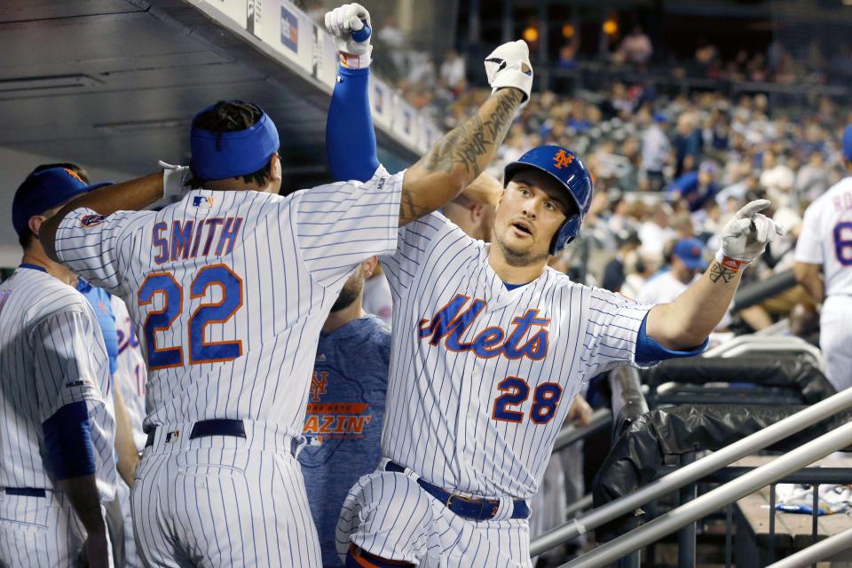 Jul 2, 2019; New York City, NY, USA; New York Mets left fielder J.D. Davis (28) celebrates his solo home run against the New York Yankees with left fielder Dominic Smith (22) during the sixth inning at Citi Field. Mandatory Credit: Brad Penner-USA TODAY Sports