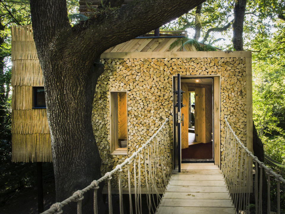 The treehouse is accessed via a jungle-style rope bridge (RIBA/SWNS)