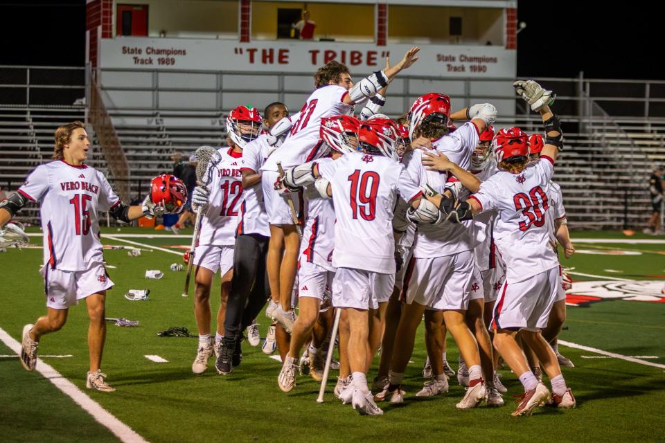 No. 1 Vero Beach celebrates their 12-11 win over No. 2 Viera in a high school lacrosse District 8-2A championship match at Vero Beach on Monday, April 15, 2024.