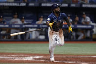 Tampa Bay Rays' Randy Arozerena hits a sacrifice fly to right field against the Houston Astros during the third inning of a baseball game Monday, April 24, 2023, in St. Petersburg, Fla. (AP Photo/Scott Audette)