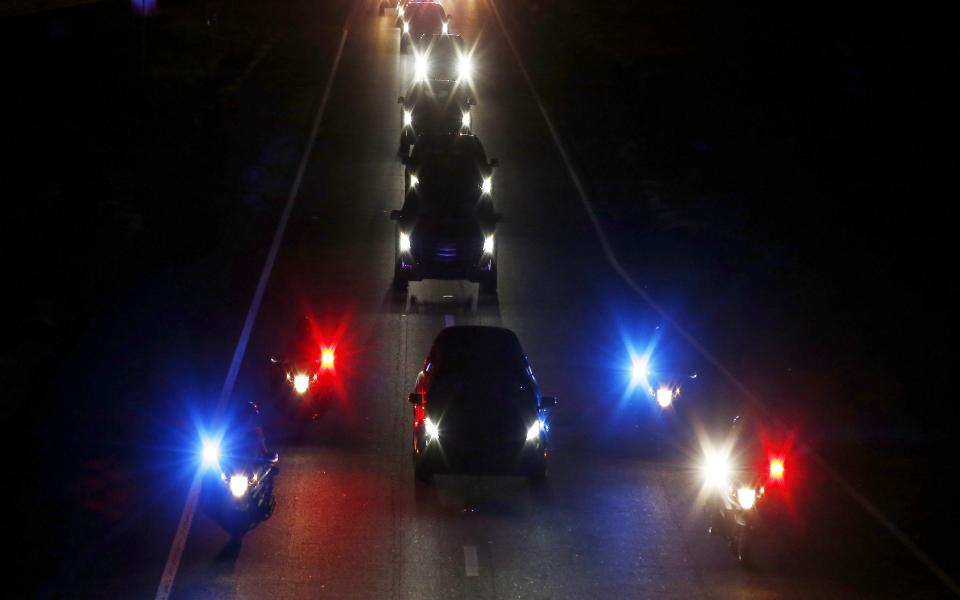 <p>With a police escort, a procession follows the hearse carrying the late Arizona Sen. John McCain along Interstate 17 on the way to Phoenix, Saturday, Aug. 25, 2018, in Anthem, Ariz. (Photo: Ross D. Franklin/AP) </p>