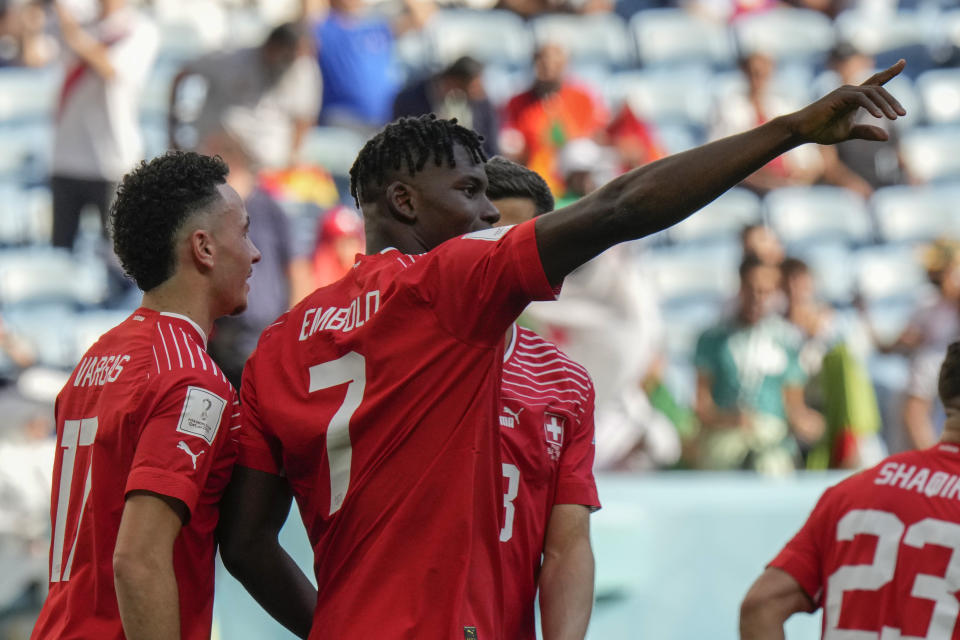 Switzerland's Breel Embolo celebrates after scoring then opening goal during the World Cup group G soccer match between Switzerland and Cameroon, at the Al Janoub Stadium in Al Wakrah, Qatar, Thursday, Nov. 24, 2022. (AP Photo/Luca Bruno)