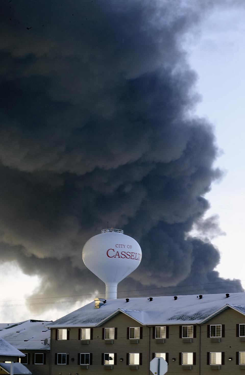 A fireball goes up at the site of an oil train derailment Monday, Dec 30, 2013, in Casselton, N.D. The train carrying crude oil derailed near Casselton Monday afternoon. Several explosions were reported as some cars on the mile-long train caught fire. (AP Photo/Bruce Crummy)