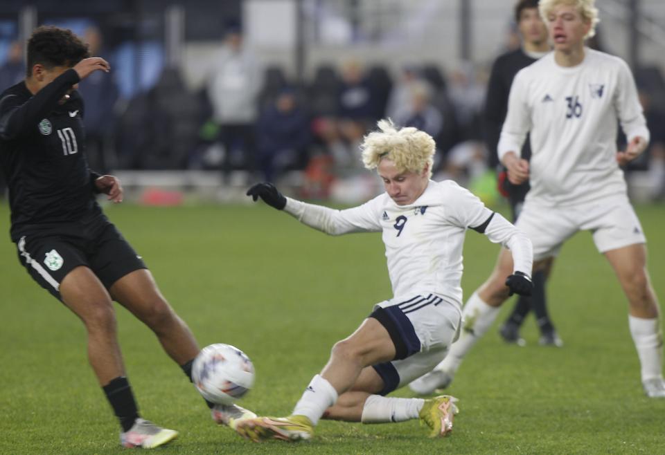 Ottawa Hills' Adam Ayad and Grandview's Will DeVere fight for the ball during the Division III state final at Lower.com Field on Nov. 12. Grandview won 3-0.