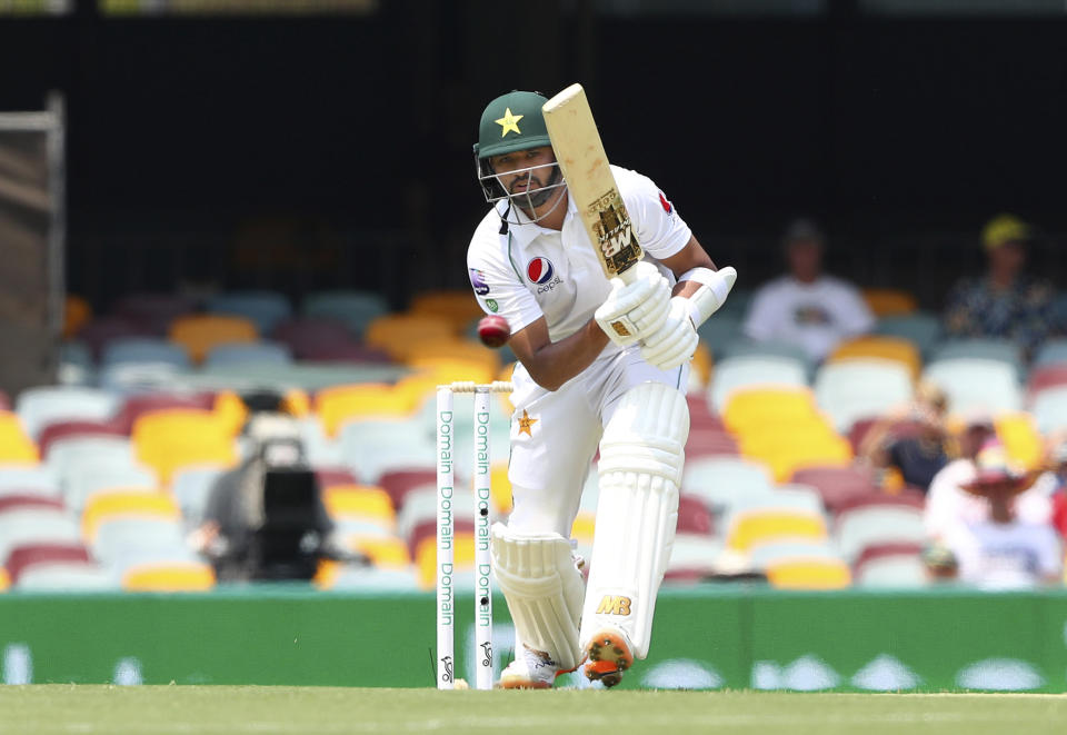 Pakistan's Azhar Ali plays a shot during the cricket test match between Australia and Pakistan in Brisbane, Australia, Thursday, Nov. 21, 2019. (AP Photo/Tertius Pickard)