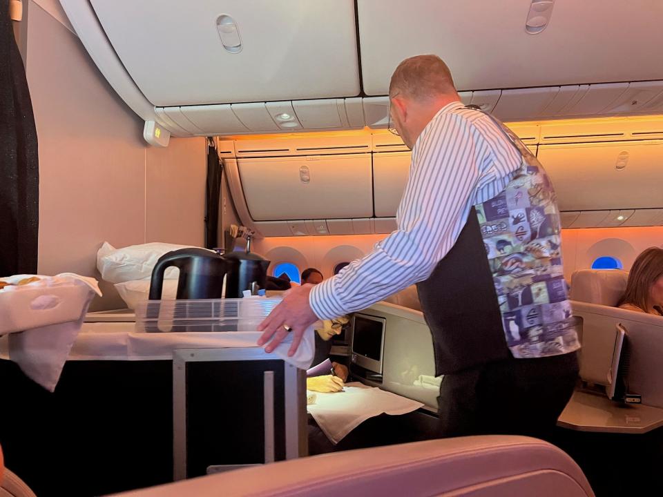 An Air New Zealand business class flight attendant.