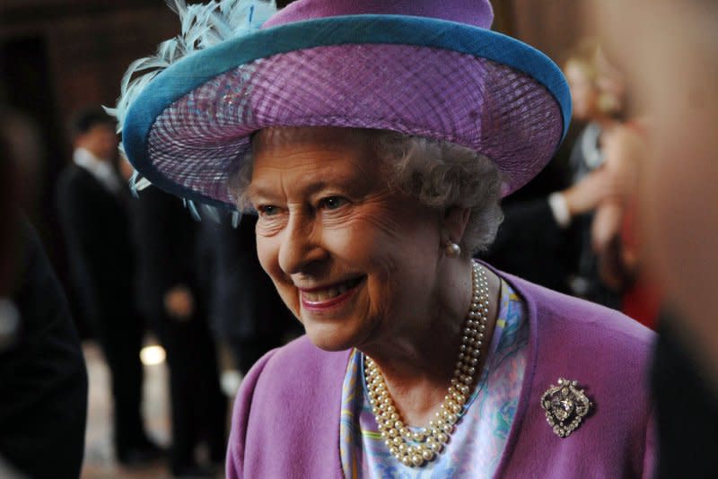 Britain's Queen Elizabeth II greets students and alumni at the Wren Building at The College of William and Mary in Williamsburg, Va., on May 4, 2007. On February 11, 1993, British Prime Minister John Major said Queen Elizabeth II would pay income tax on her personal income as well as being subject to capital and inheritance levies. File Photo by Rodney Lamkey/UPI