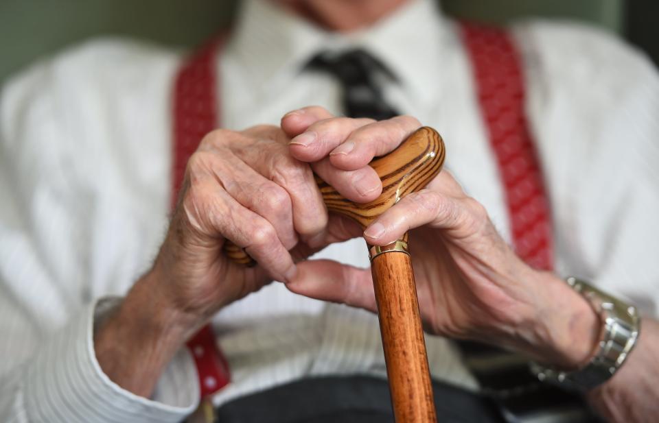 Elderly man with walking stick (PA Archive)