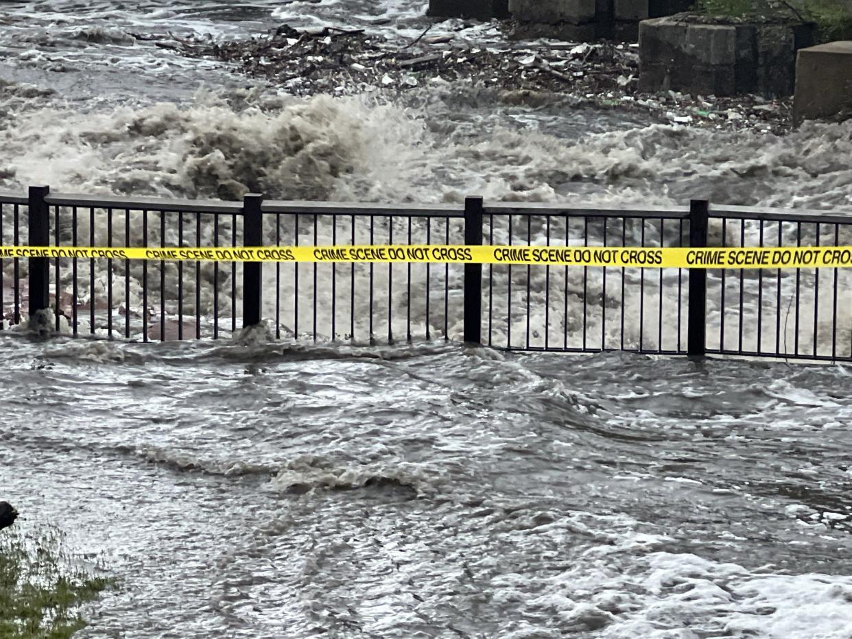 Floodwaters surge in Sioux Falls, South Dakota, after heavy rain Friday. Flooding is widespread there and in adjacent northwest Iowa, where some residents were being evacuated.
