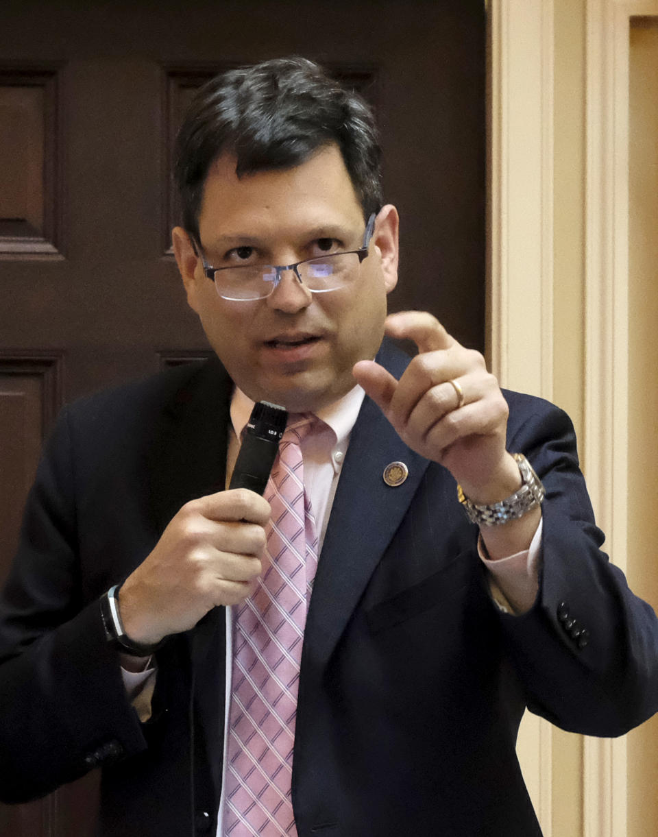 Sen. Scott Surovell, D-Fairfax, speaks for SB35, his bill relating to control of firearms by localities that was debated in the Virginia Senate inside the State Capitol in Richmond, Va., Thursday, Jan. 16, 2020. (Bob Brown/Richmond Times-Dispatch via AP)