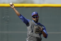 Texas Rangers' Elvis Andrus throws during spring training baseball practice Monday, Feb. 17, 2020, in Surprise, Ariz. (AP Photo/Charlie Riedel)