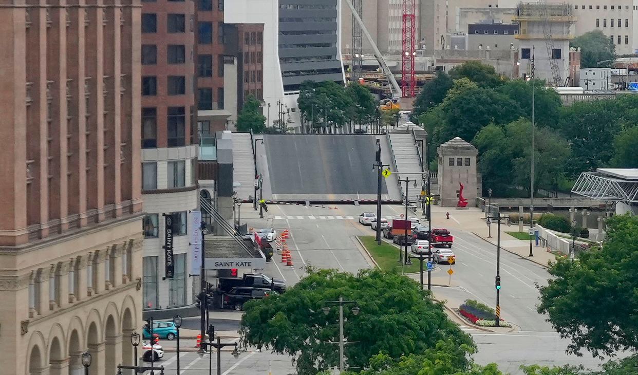 A drawbridge goes back down after a boat passes through along East Kilbourn Avenue on the Milwaukee River in Milwaukee on Monday, Aug. 8, 2022.