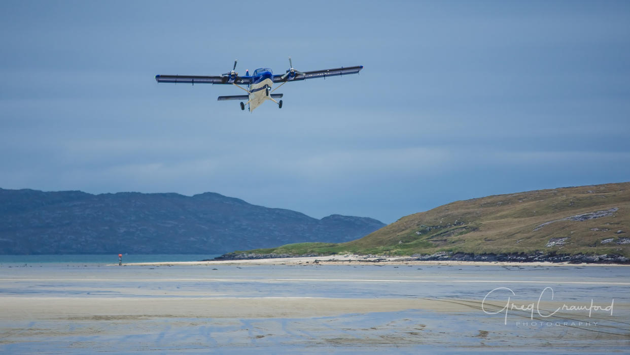  Plane coming in to land on Barra Island. 