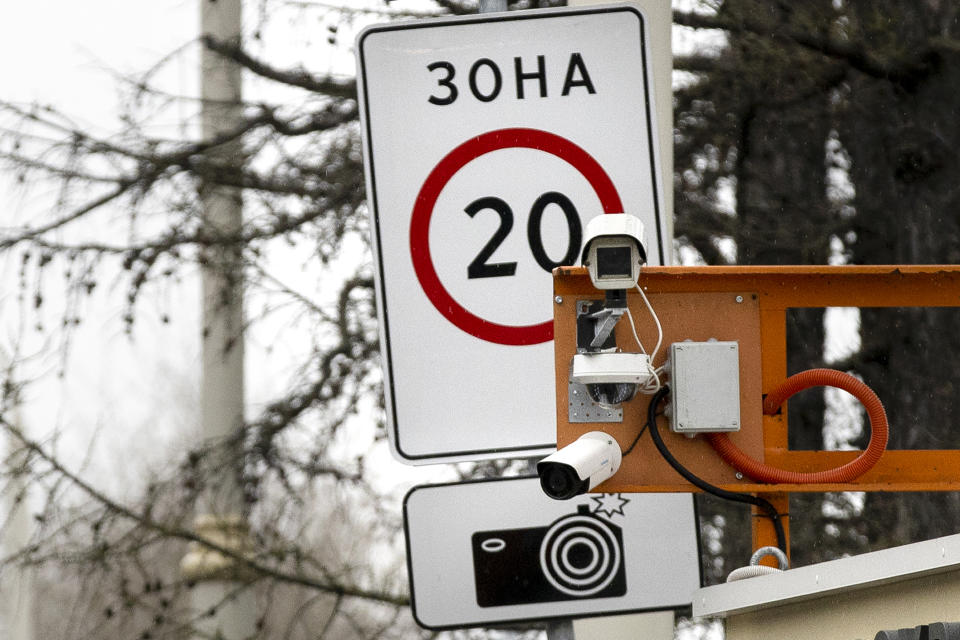 In this May 7, 2018, photo, CCTV cameras are installed over a road in Moscow, Russia. After two coronavirus cases were reported in February, Mayor Sergei Sobyanin authorized facial recognition software to track Chinese nationals in the capital, drawing complaints from human rights groups. (AP Photo/Pavel Golovkin)