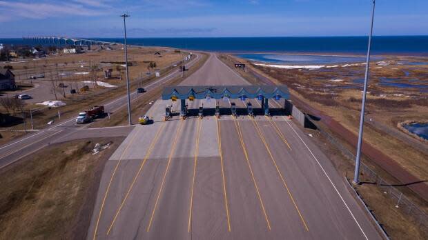 With border restrictions extended another two weeks, the toll booths at Confederation Bridge will remain quiet. (Shane Hennessey/CBC - image credit)