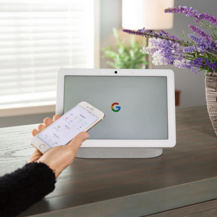 Google home tablet on table with phone control capability