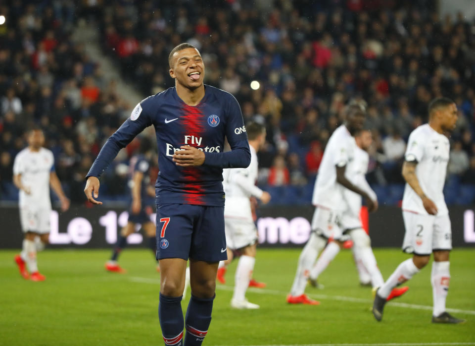 PSG's Kylian Mbappe celebrates after scoring his side's fourth goal during their League One soccer match between Paris Saint Germain and Dijon at the Parc des Princes stadium in Paris, France, Saturday, May 18, 2019. (AP Photo/Francois Mori)