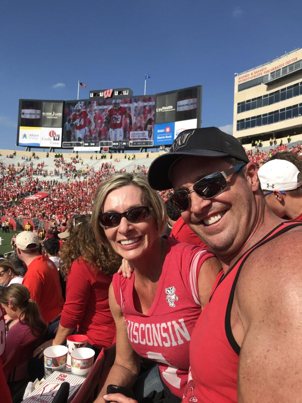 Steve Henneberry, once known as Tower on American Gladiators, and his wife Terri attend a University of Wisconsin football game in 2022.