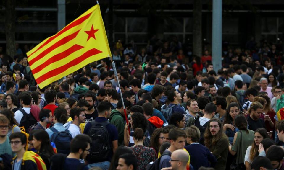 Students wave an Estelada (Catalan separatist flag) during a gathering to protest against the imprisonment of leaders of two of the largest Catalan separatist organisations in Barcelona.