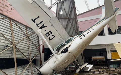 A damaged aircraft at the airport in Beira, Mozambique, in the aftermath of Cyclone Idai - Credit: AFP