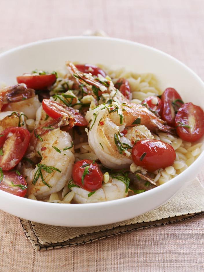 <p>Although it's shaped like a large grain of rice, orzo is actually pasta made of wheat semolina. It plumps up while cooking and is a master at absorbing sauces, which makes it terrific for this tomato sauce-based dish.</p><p><a href="https://www.womansday.com/food-recipes/food-drinks/recipes/a11299/shrimp-spinach-and-feta-orzo-recipe/" rel="nofollow noopener" target="_blank" data-ylk="slk:Get the Shrimp, Spinach & Feta Orzo recipe." class="link rapid-noclick-resp"><em>Get the Shrimp, Spinach & Feta Orzo recipe.</em></a> </p>
