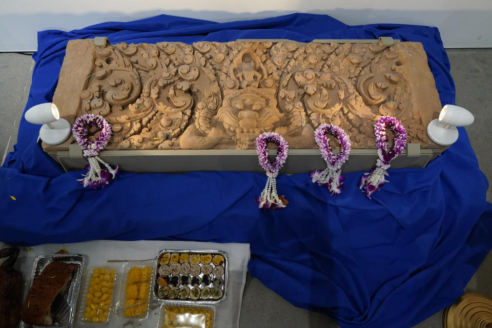 A lentil originally from the Khoa Lon Sanctuary in Thailand is displayed during a ceremony to return it and another stolen hand-carved sandstone lintel dating back to the 9th and 10th centuries to the Thai government Tuesday, May 25, 2021, in Los Angeles. The 1,500-pound (680-kilogram) antiquities had been stolen and exported from Thailand — a violation of Thai law — a half-century ago, authorities said, and donated to the city of San Francisco. They had been exhibited at the San Francisco Asian Art Museum. (AP Photo/Ashley Landis)