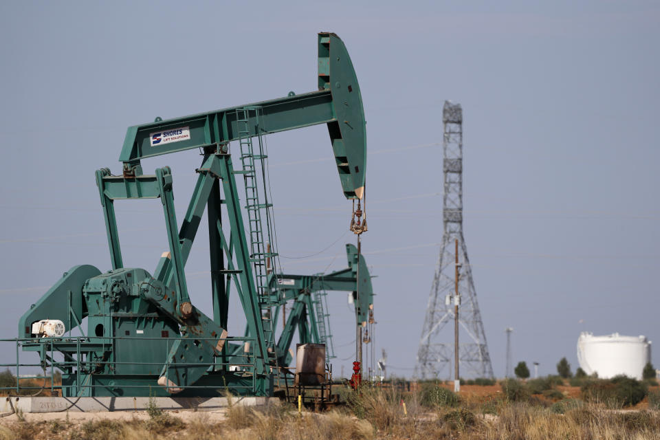 Pump jacks are shown in an oil field, Wednesday, July 29, 2020, in Midland, Texas. (AP Photo/Tony Gutierrez)