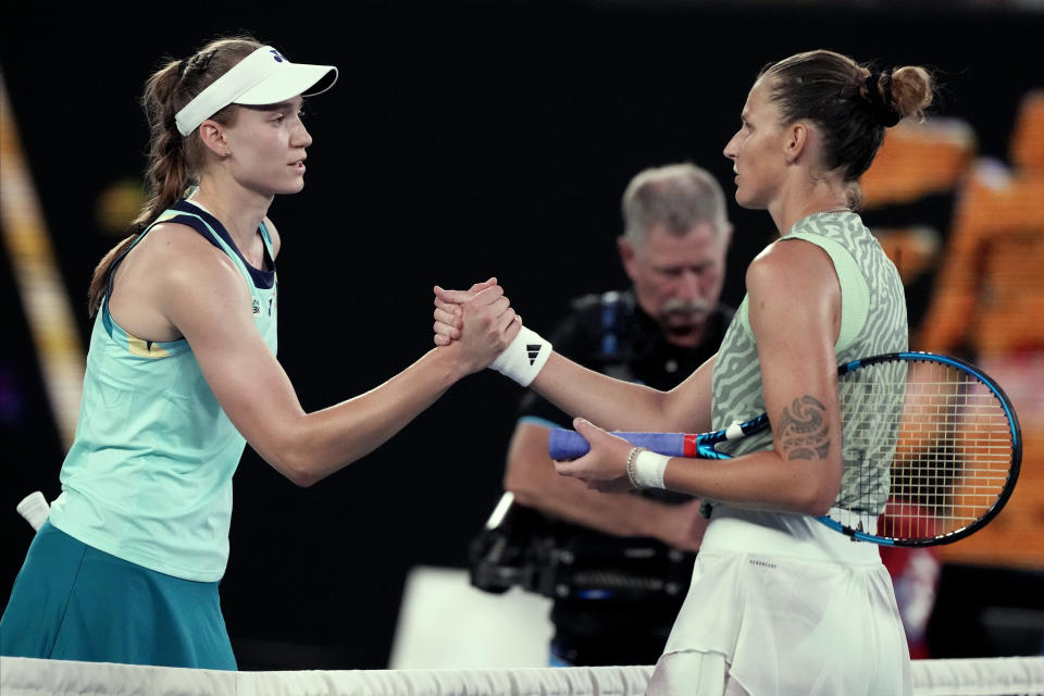 Elena Rybakina, left, of Kazakhstan is congratulated by Karolina Pliskova of the Czech Republic following their first round match at the Australian Open tennis championships at Melbourne Park, Melbourne, Australia, Tuesday, Jan. 16, 2024. (AP Photo/Andy Wong)