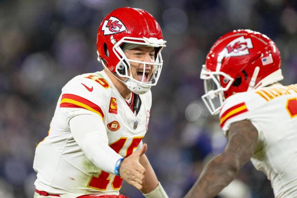 Kansas City Chiefs quarterback Patrick Mahomes (15) celebrates a first down reception with wide receiver Marquez Valdes-Scantling (11) during the AFC Championship Game against the Baltimore Ravens on Sunday, Jan. 28, 2024, in Baltimore.
